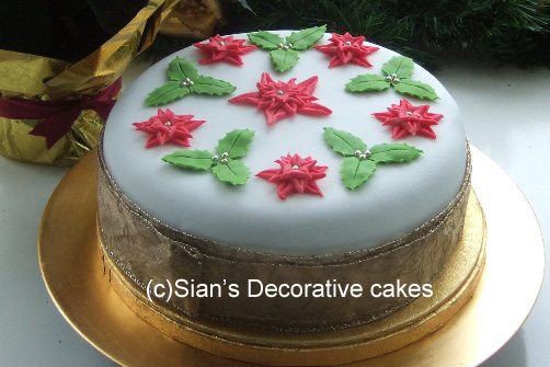 Christmas cake with red and green holly
